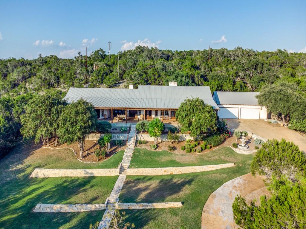 an aerial view of a house having yard