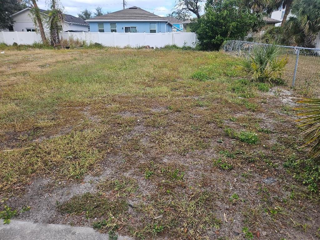 a view of a big house with a yard