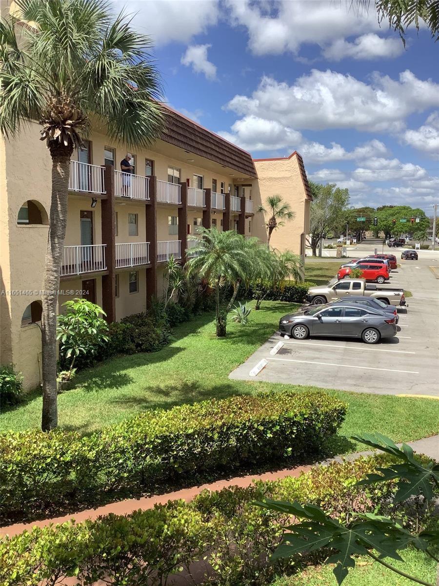 a view of a parked cars in front of house