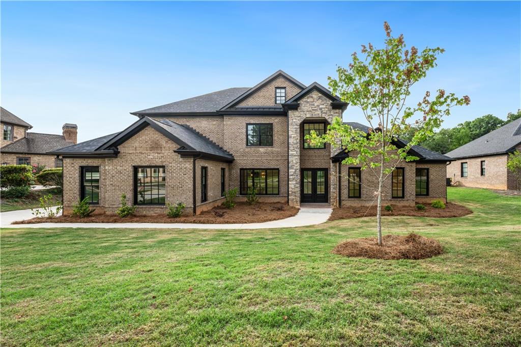 a front view of a house with a yard