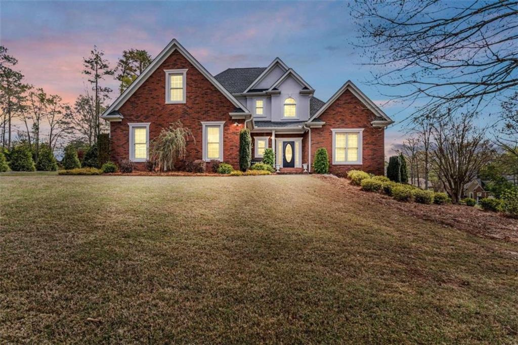 a front view of a house with a yard