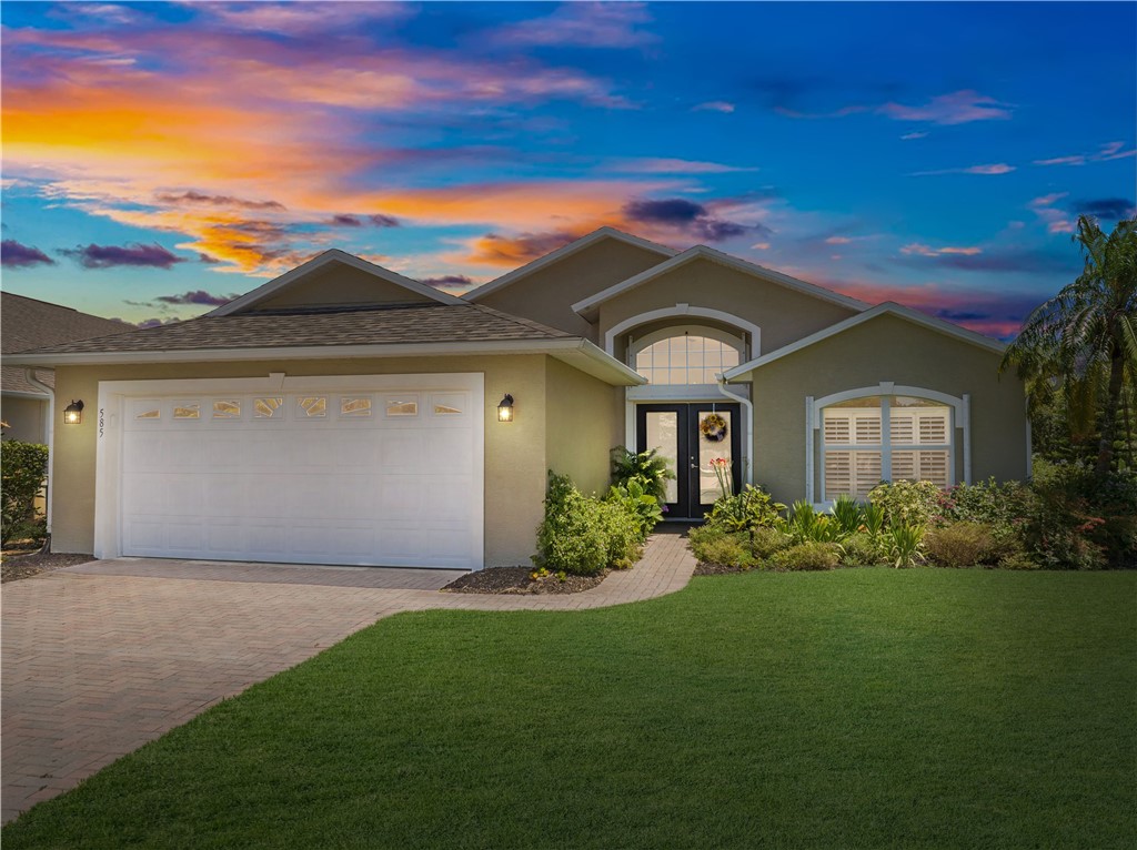 a front view of a house with a yard