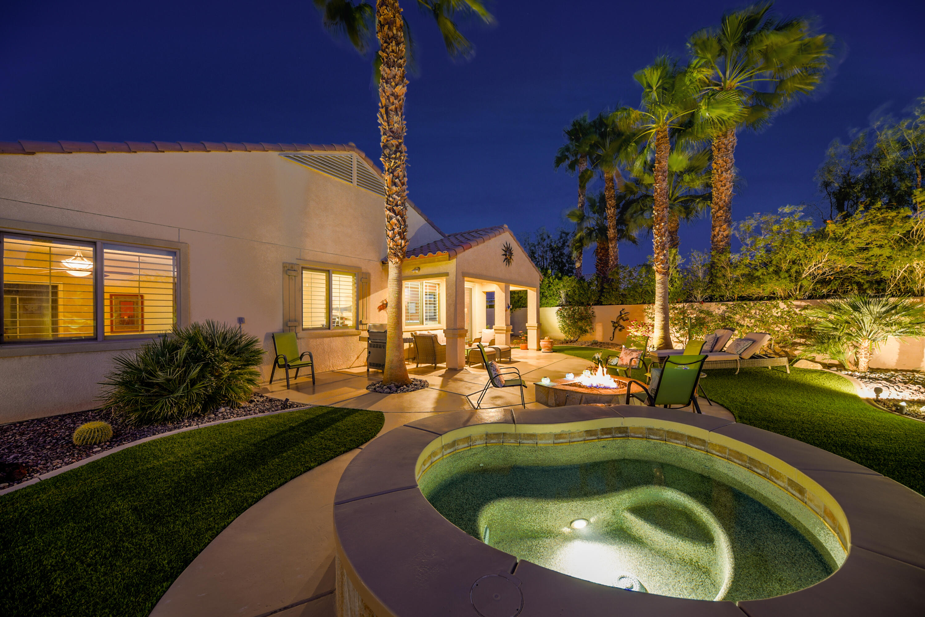 a view of swimming pool having outdoor seating