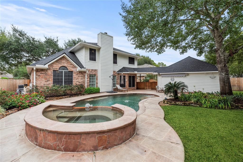 a house view with a swimming pool