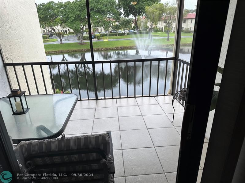 a view of balcony with wooden floor and outdoor space