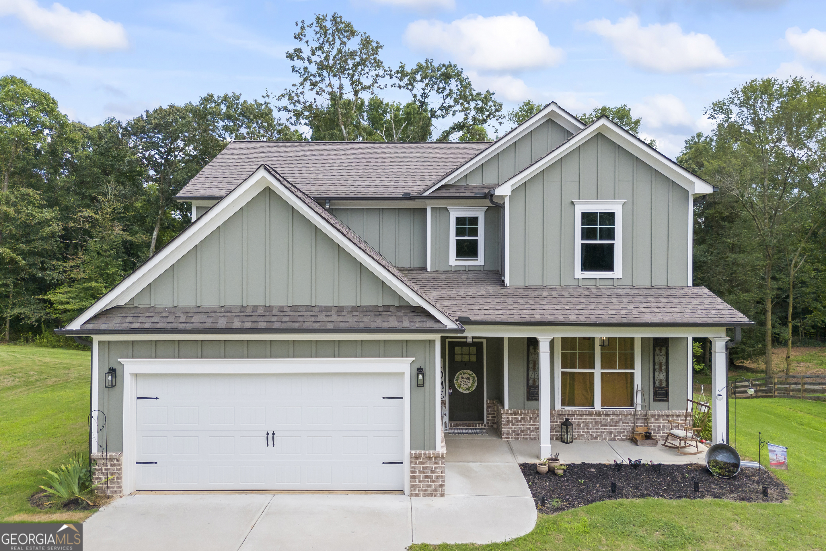 a front view of a house with a yard