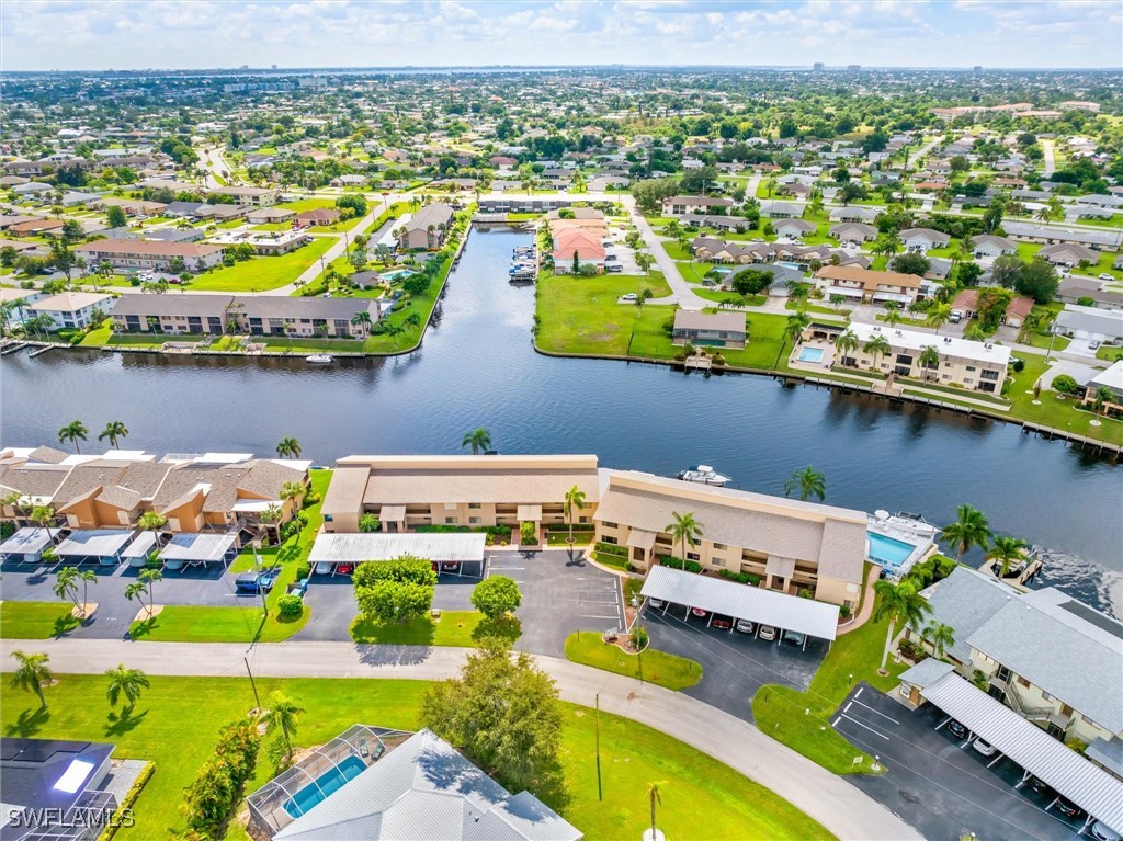 an aerial view of a house with a lake view