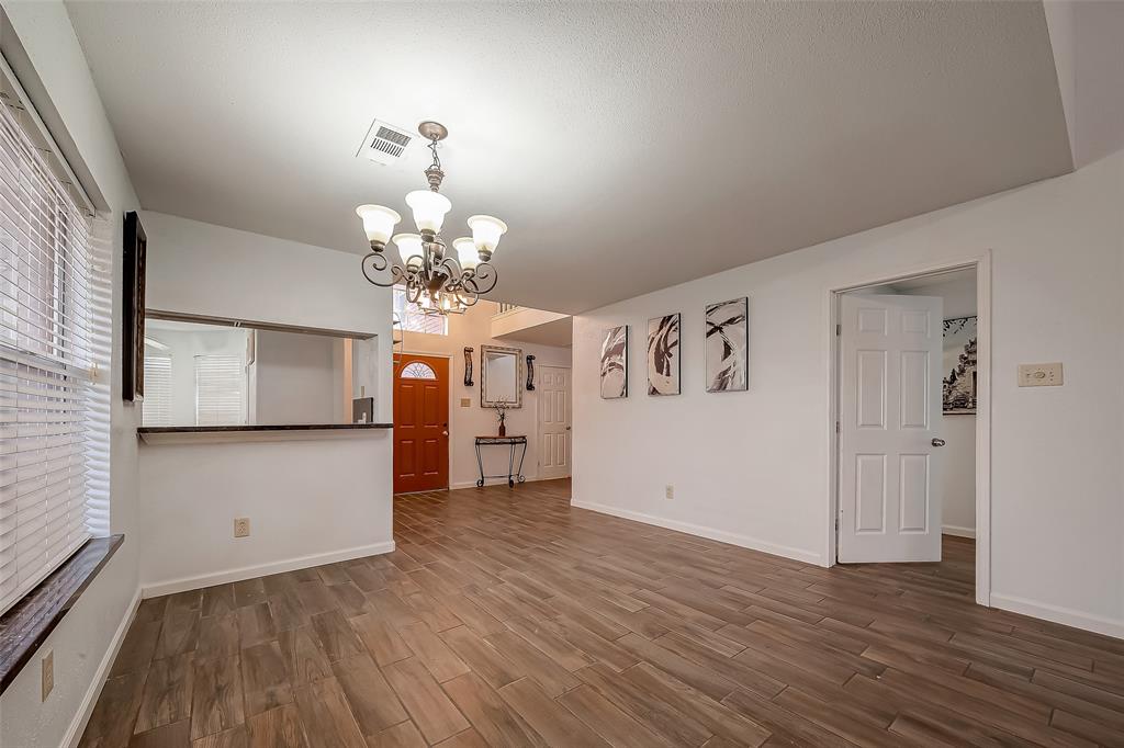 a view of a livingroom with wooden floor