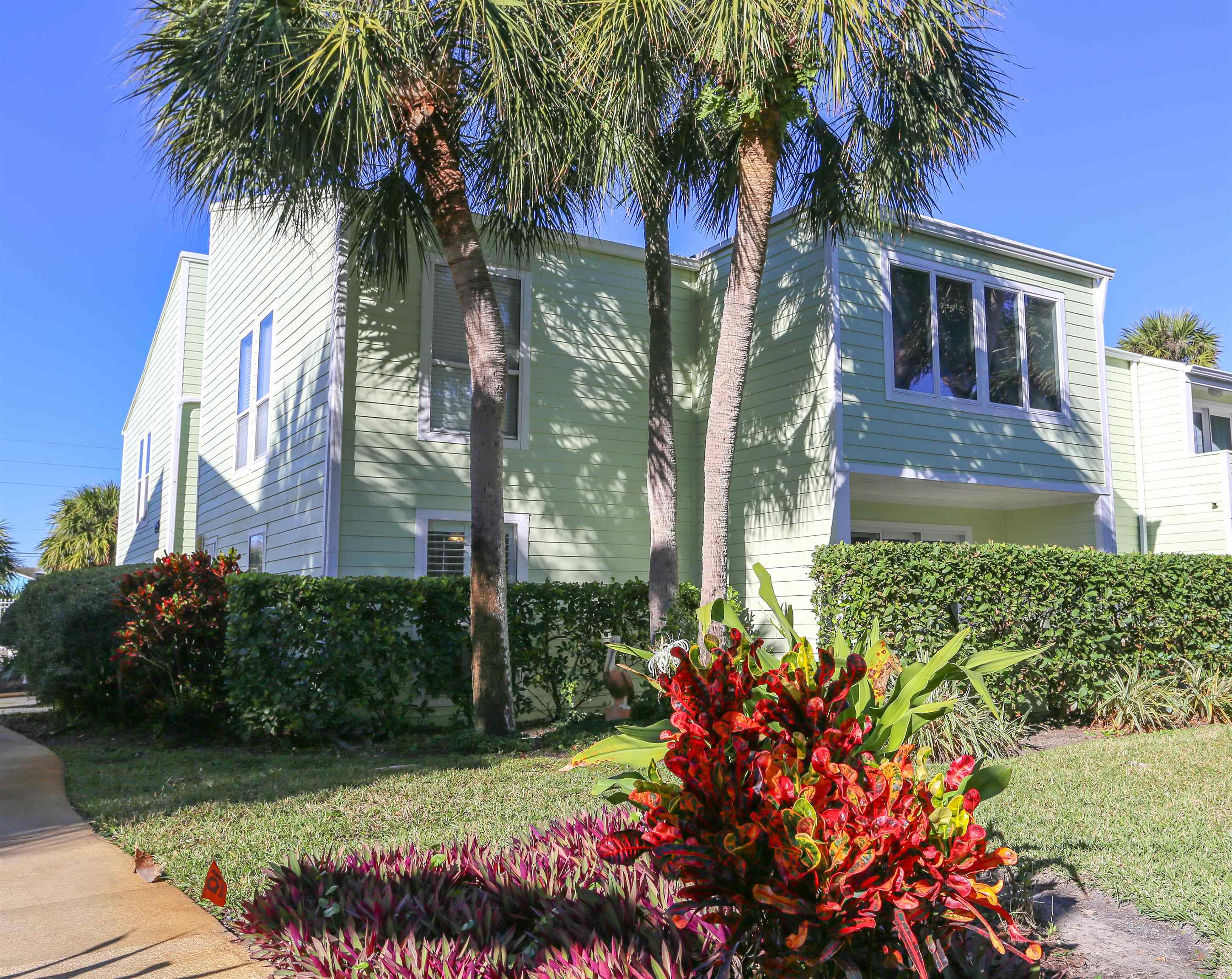 front view of a house with a garden