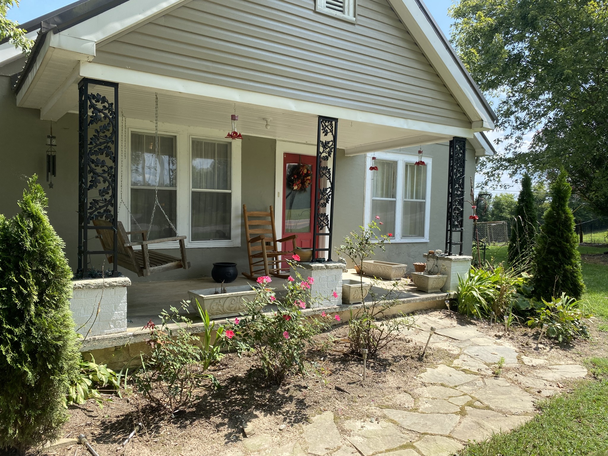 a front view of a house with garden