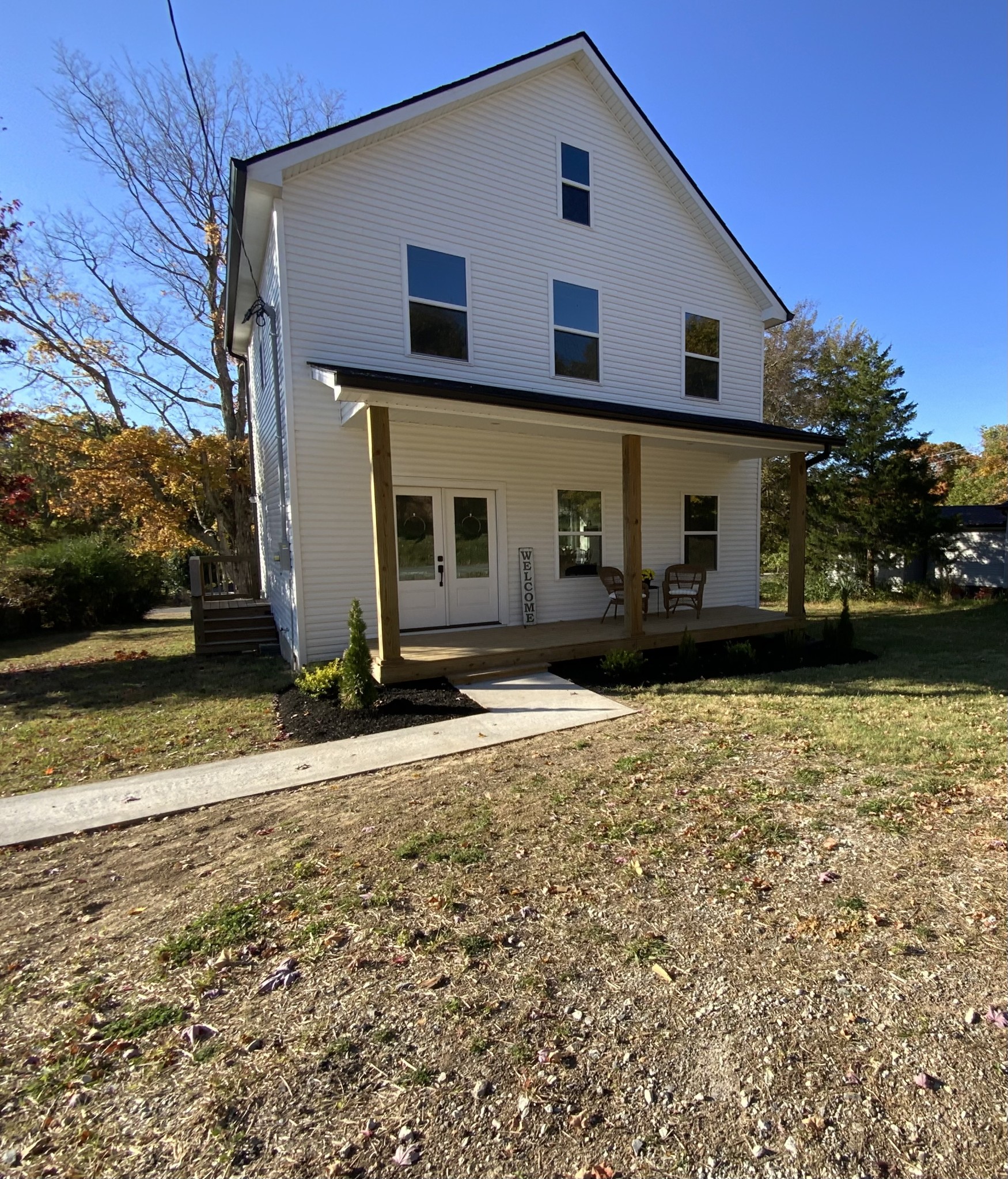 a front view of a house with a yard