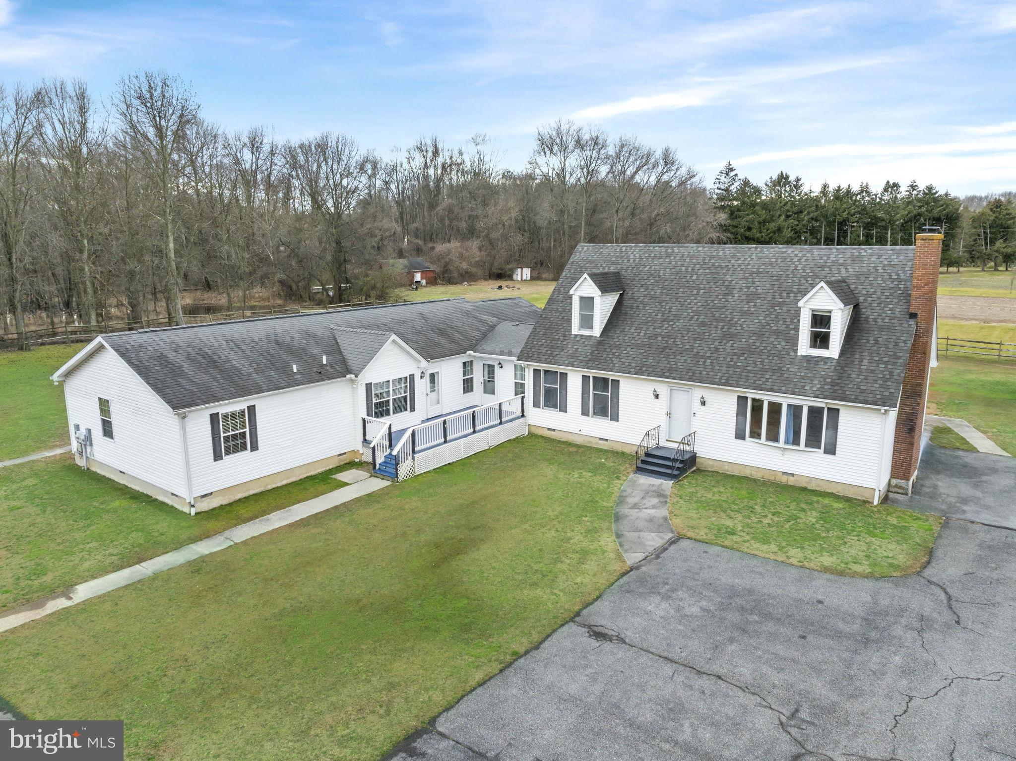 a aerial view of a house with a yard