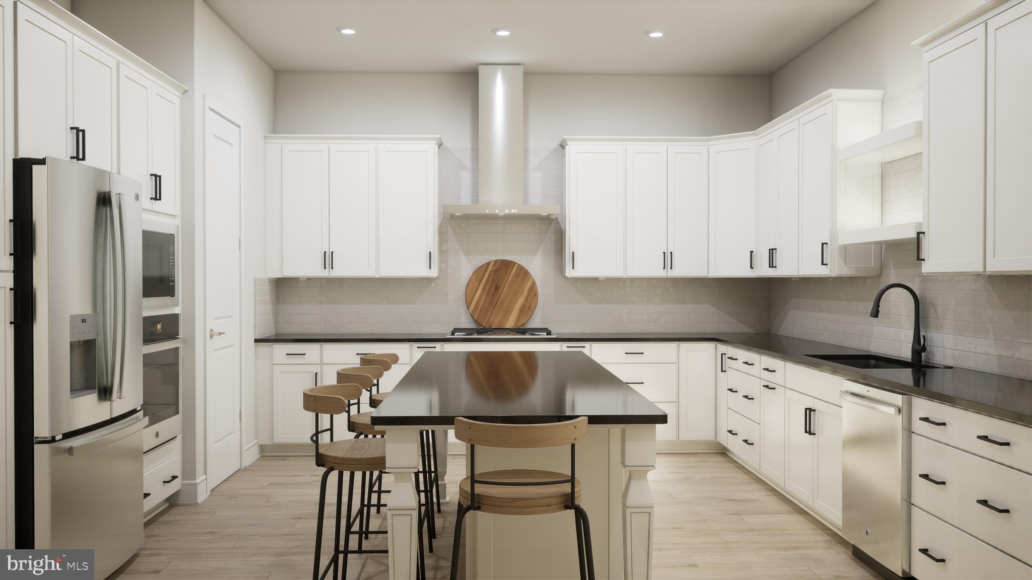 a kitchen with stainless steel appliances a table chairs in it and wooden floors