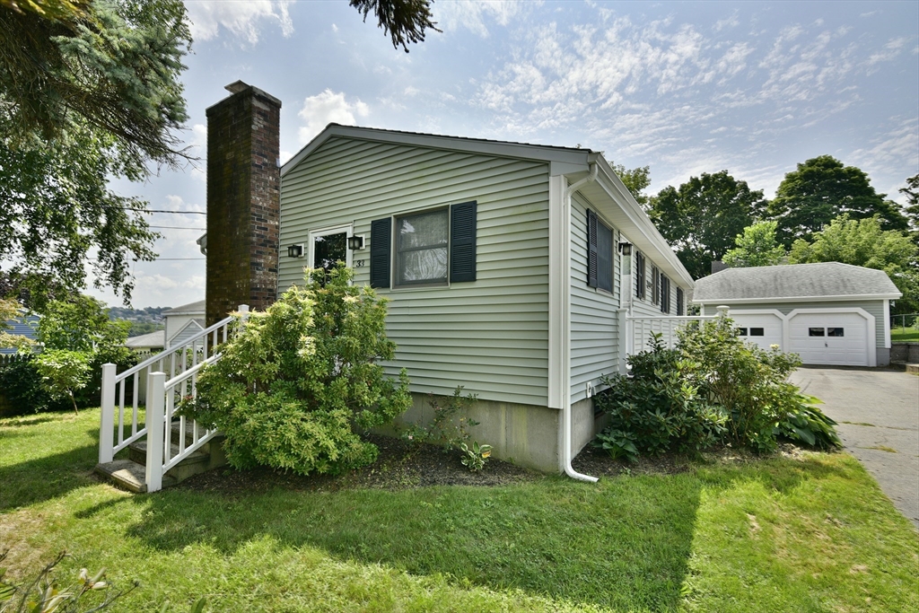 a front view of house with garden