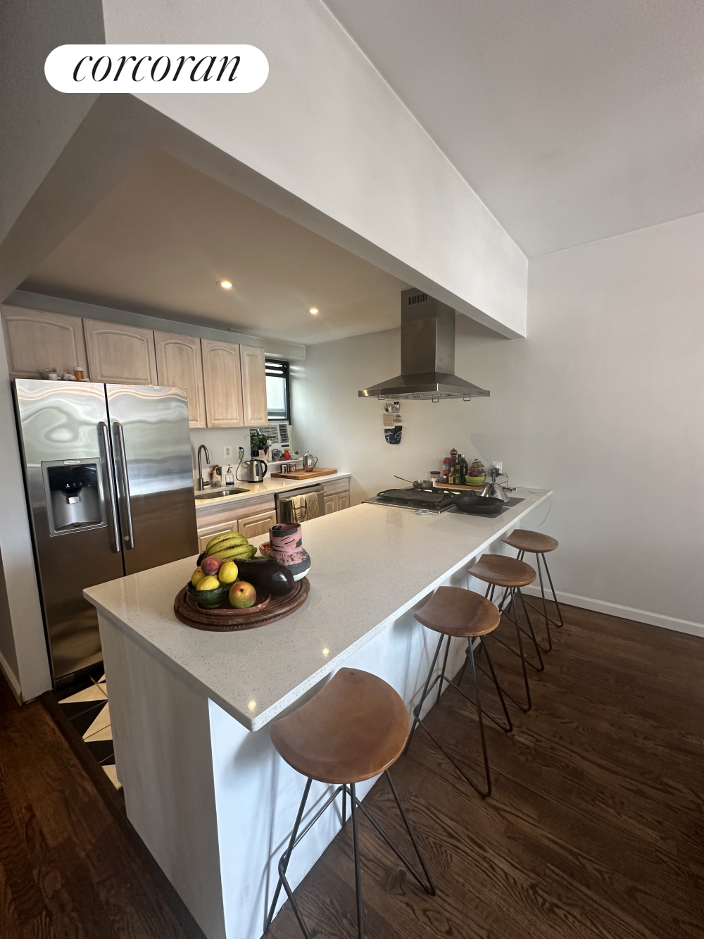 a kitchen with a table chairs and a refrigerator