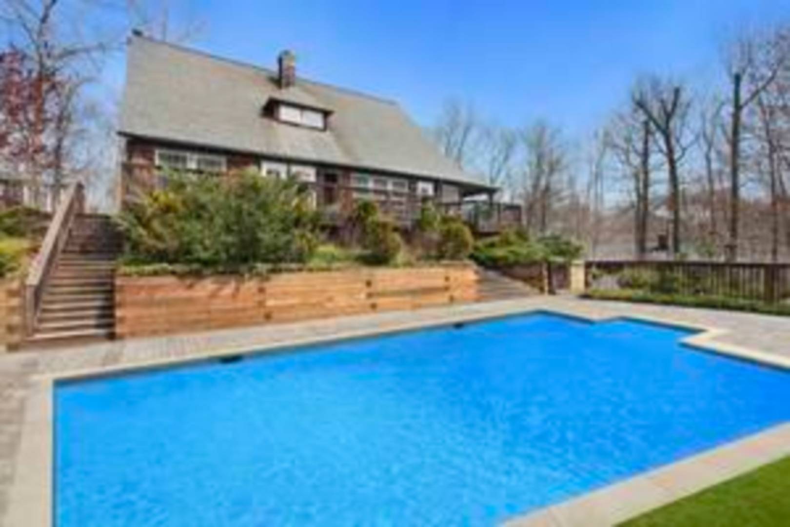 a view of swimming pool with seating space