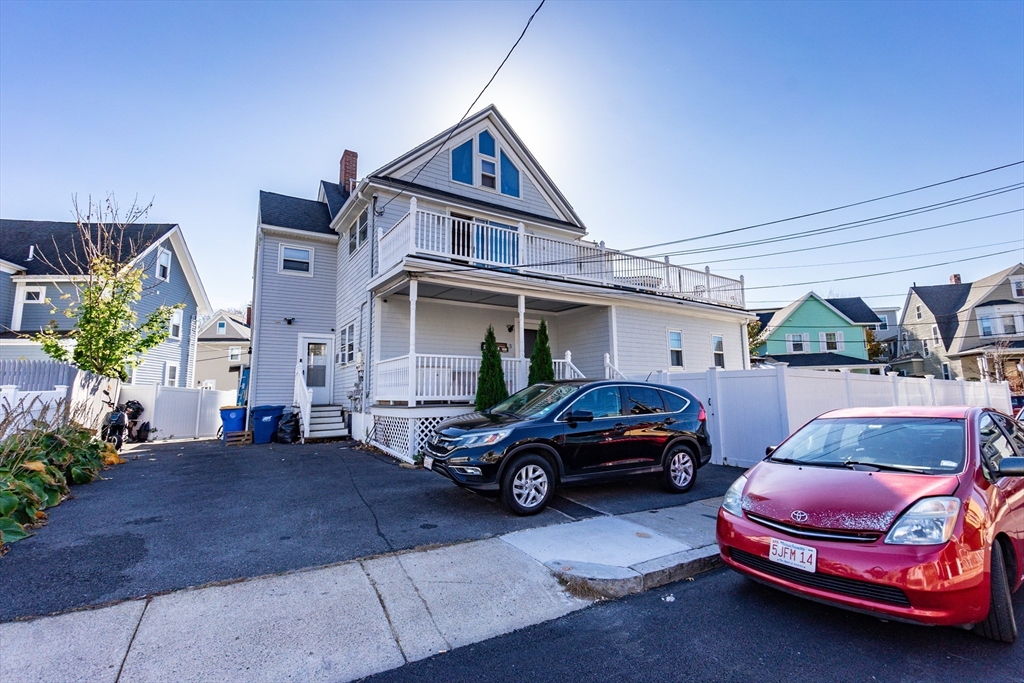 a house view with a car parked in front of it