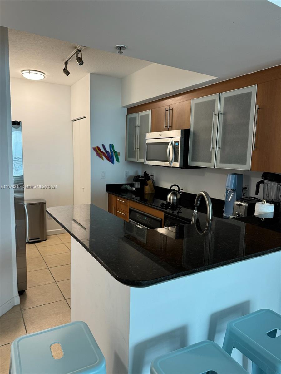 a kitchen with a sink a stove and refrigerator