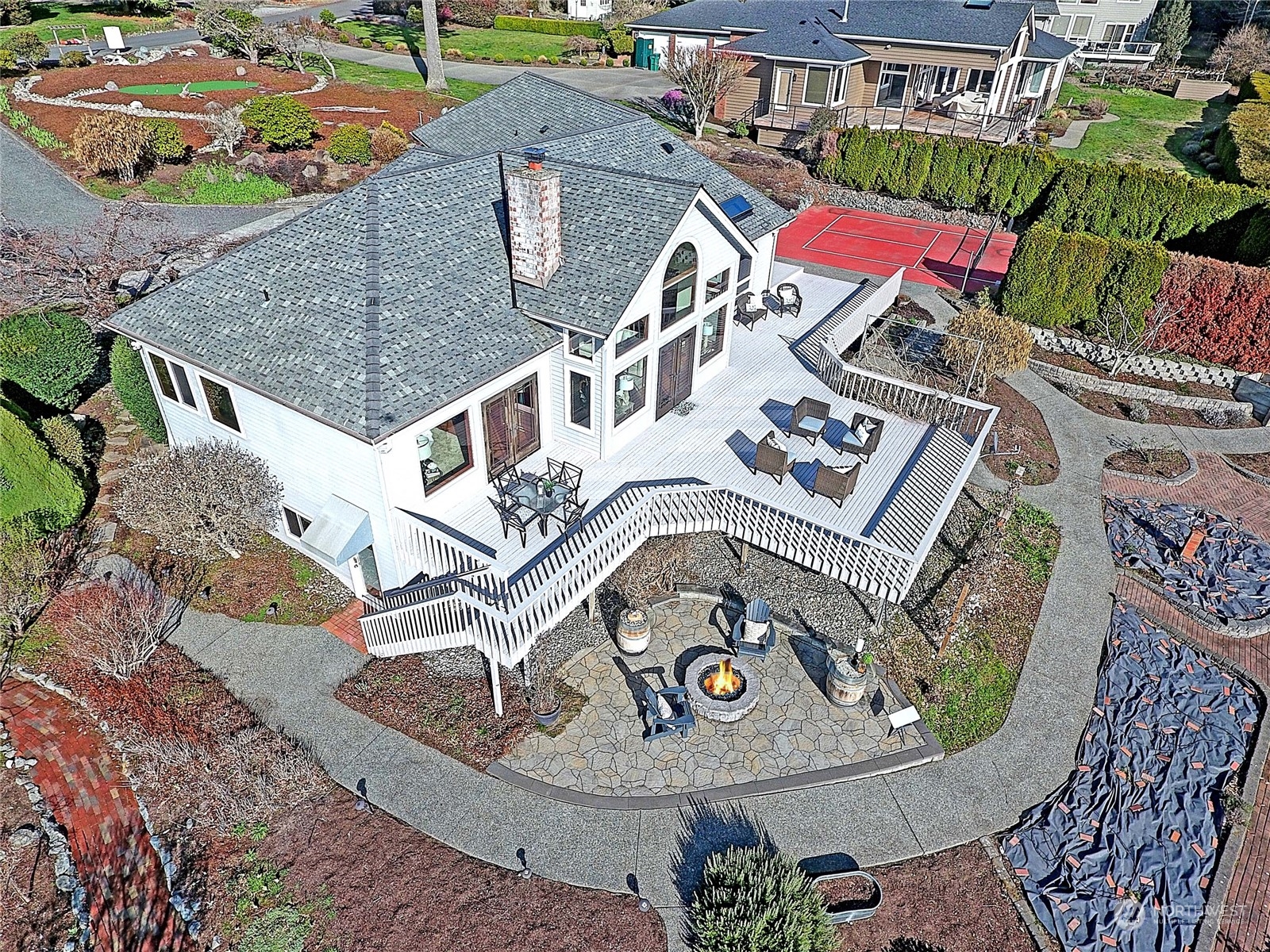 an aerial view of a house with a swimming pool