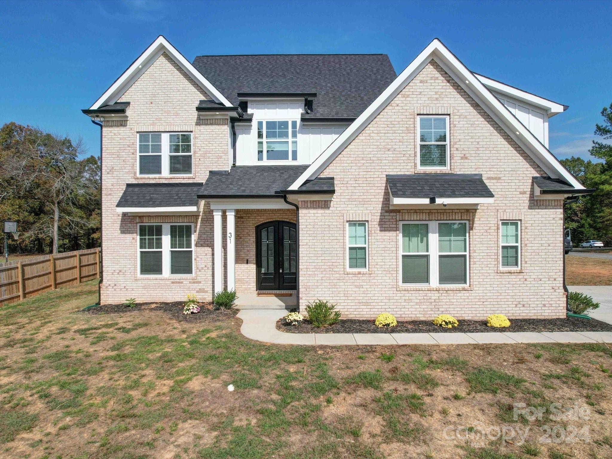 a front view of a house with yard