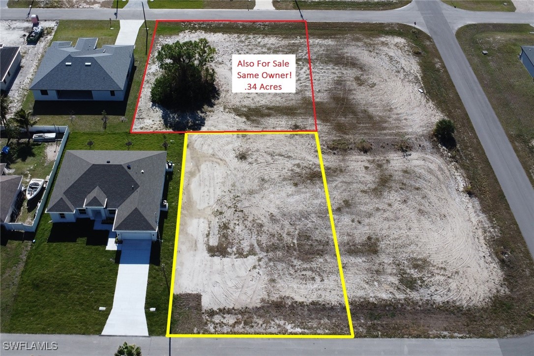 a aerial view of a brick house with a yard