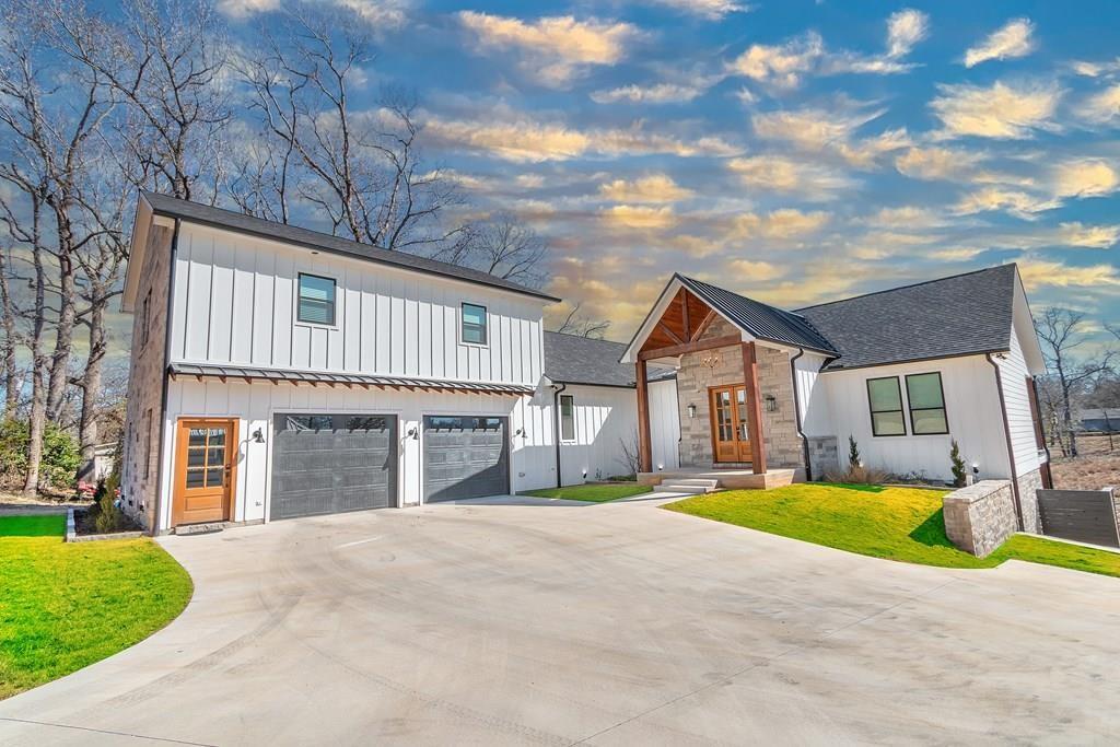 a front view of a house with a yard and garage