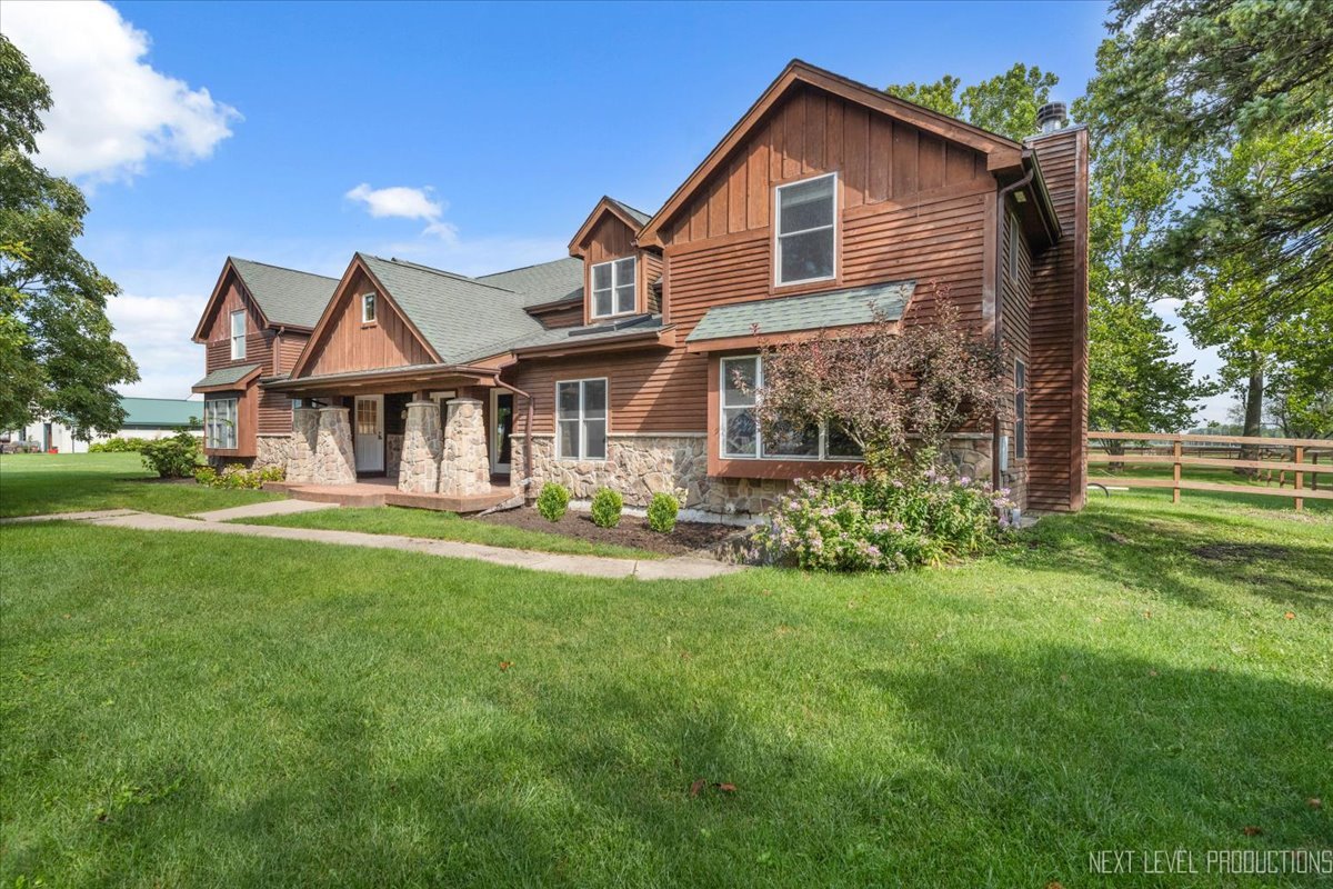 a front view of a house with a yard and porch