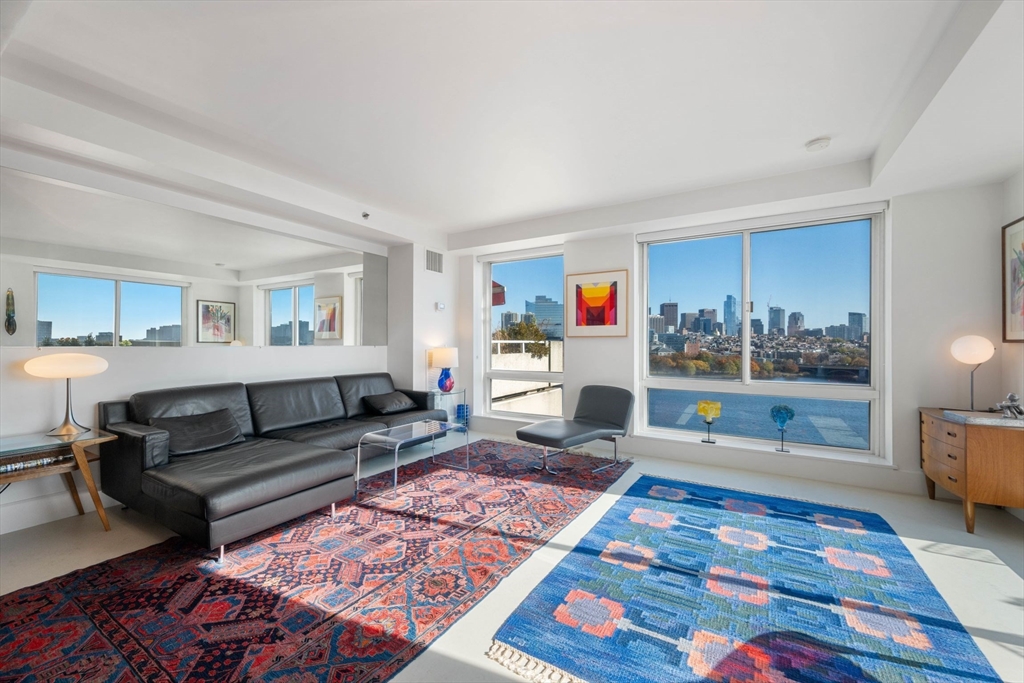 a living room with furniture and a rug