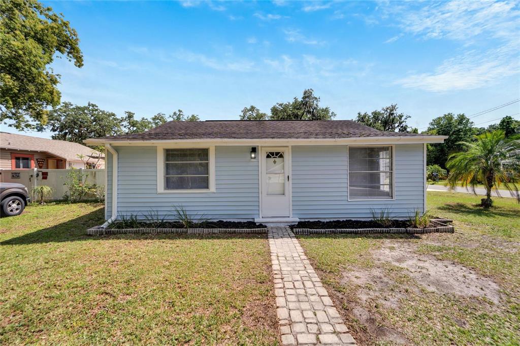 a front view of a house with a yard