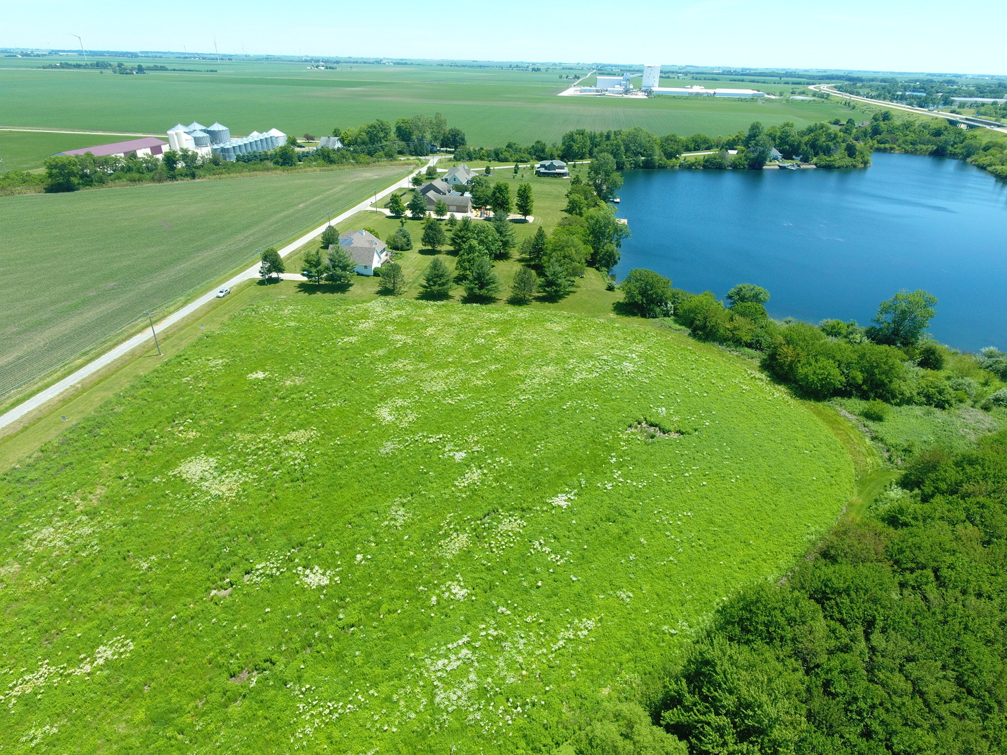 a view of a lake with a big yard