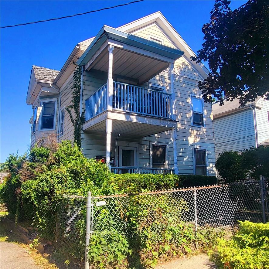 Rear view of house with a balcony