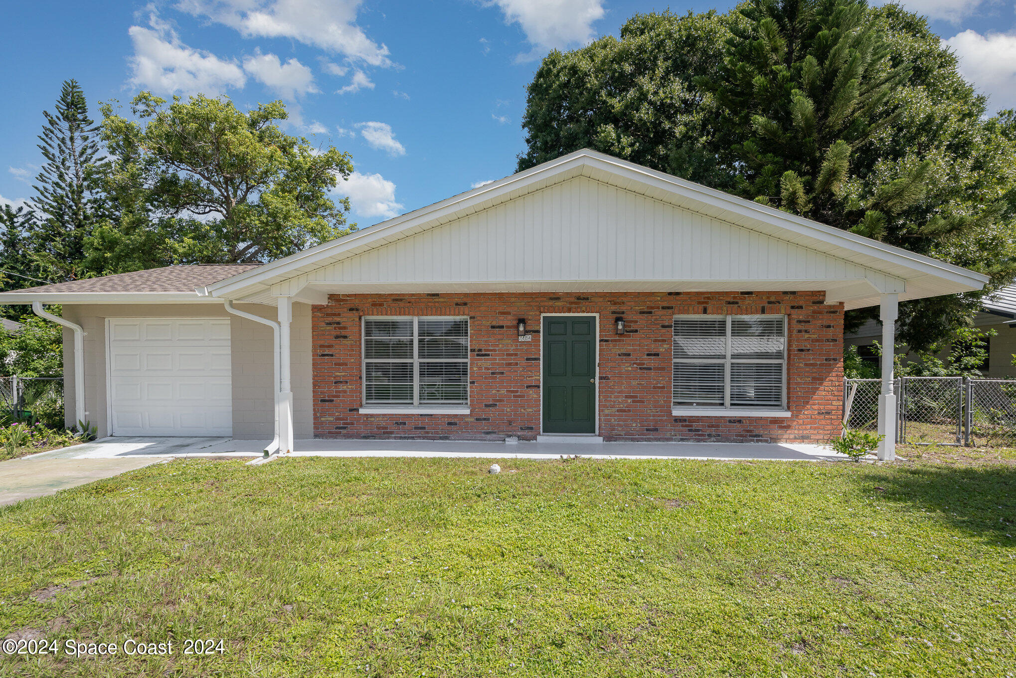 front view of a house with a yard