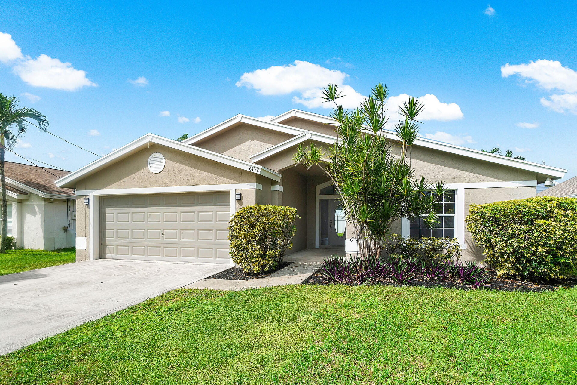 a front view of a house with garden