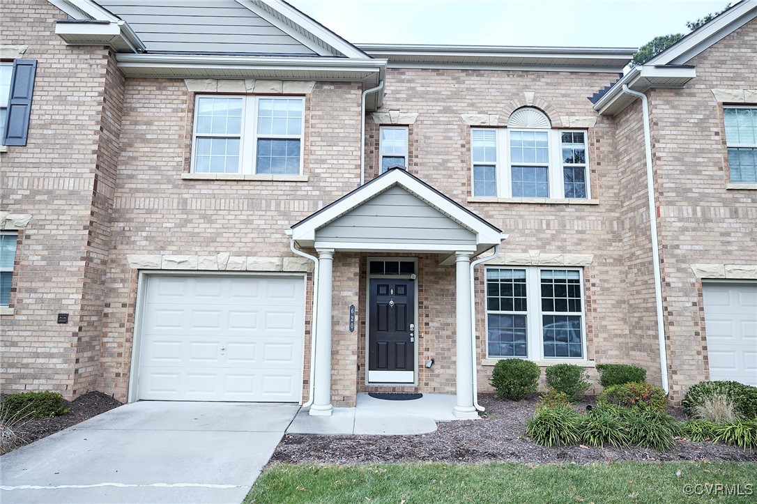 View of property featuring a garage