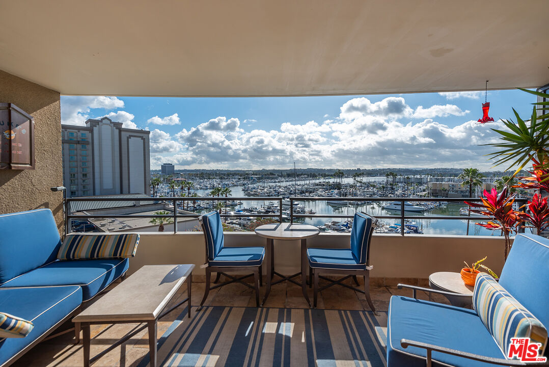 a view of a chairs and table in terrace