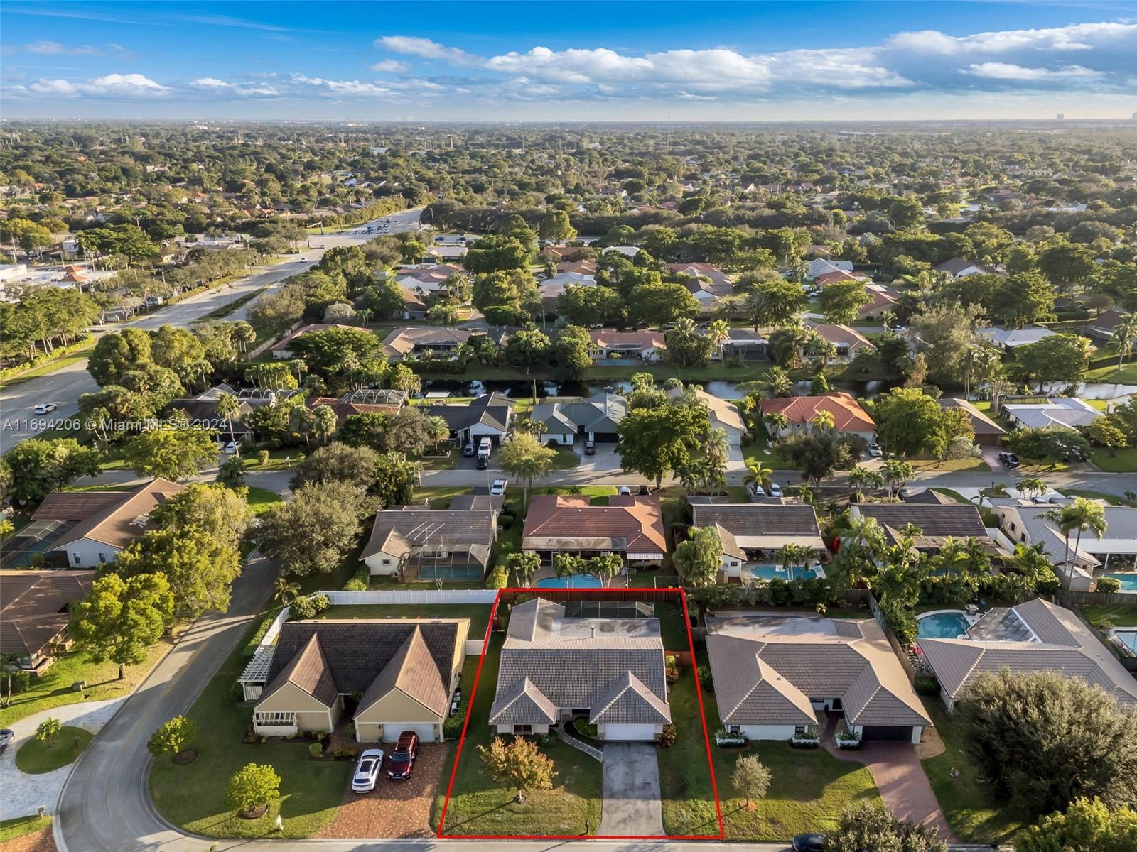 an aerial view of residential houses with outdoor space and seating