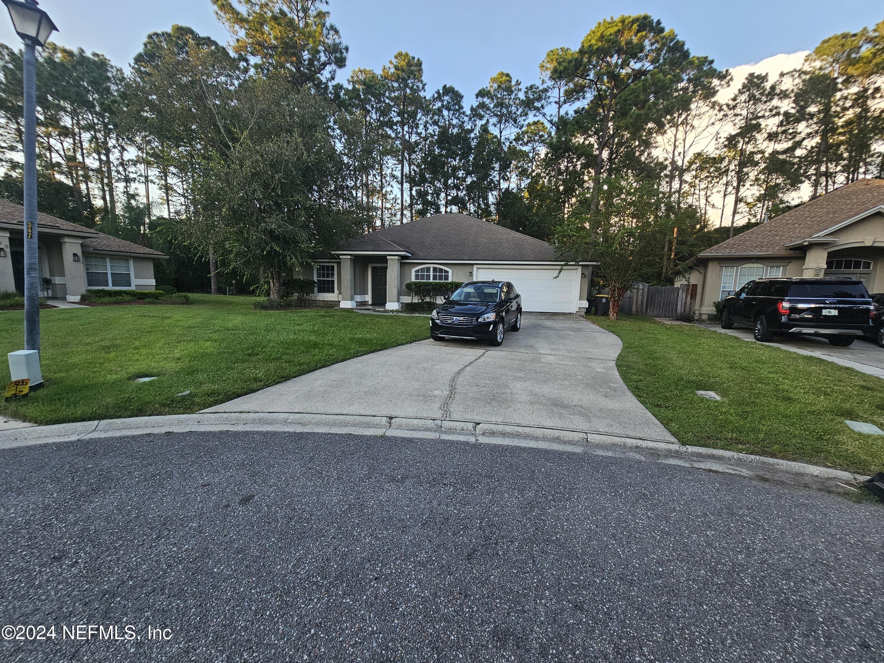 a view of a house with a back yard