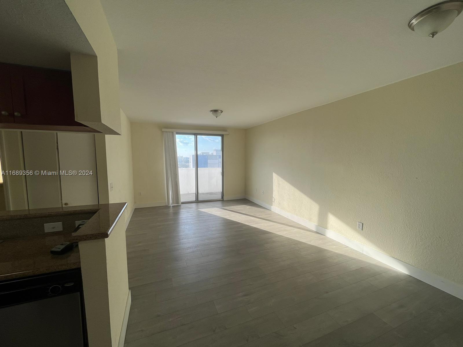 a view of an empty room and window