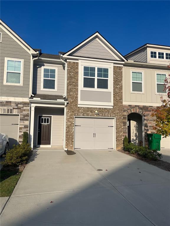 a front view of a house with yard