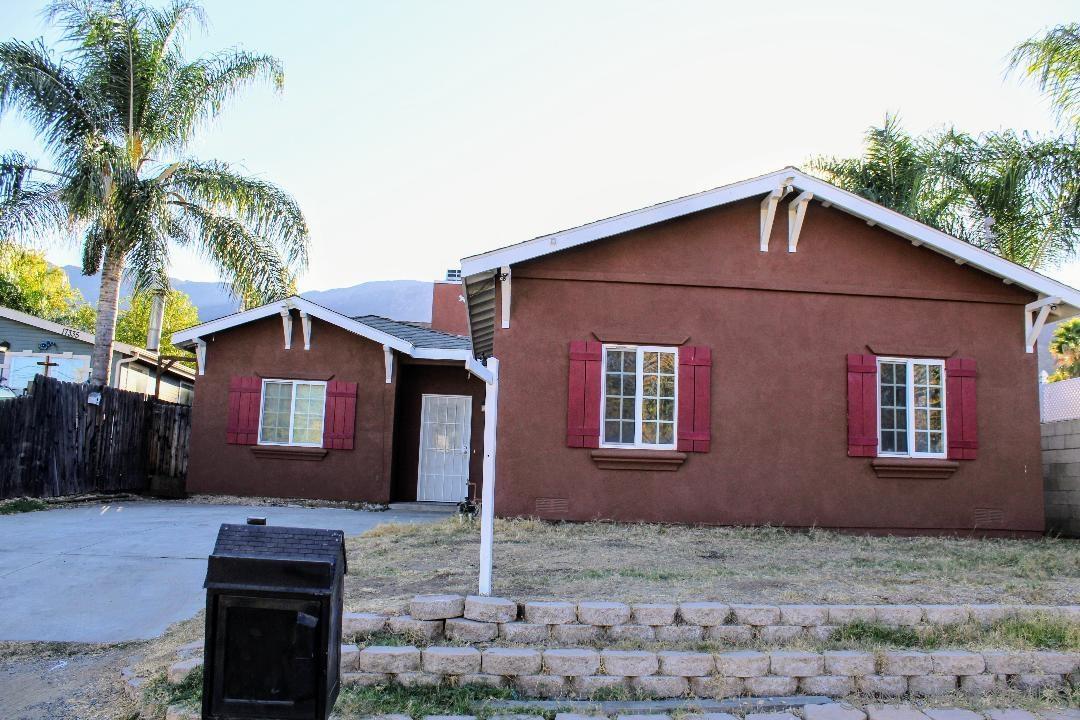 a front view of a house with yard