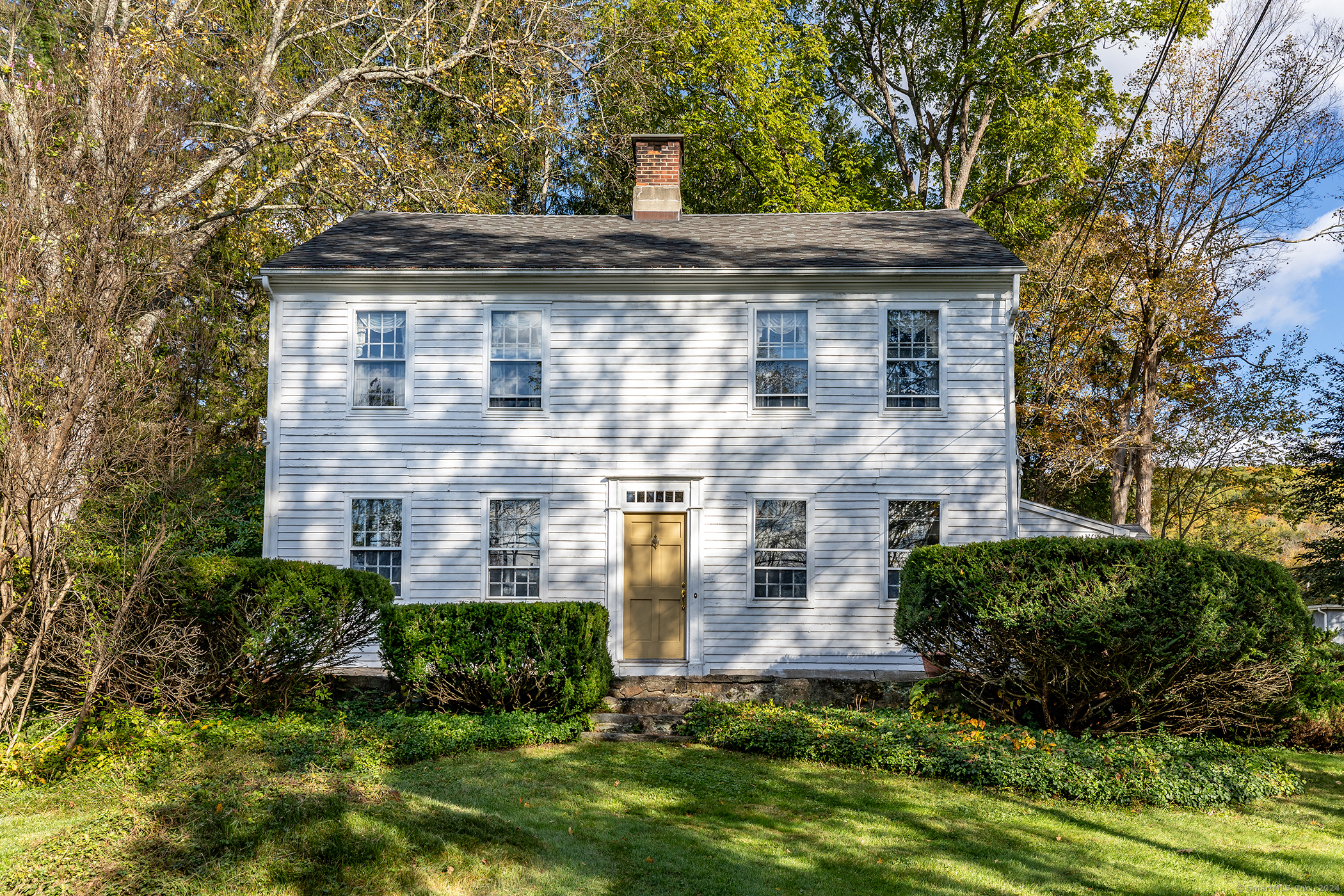 a front view of a house with a yard