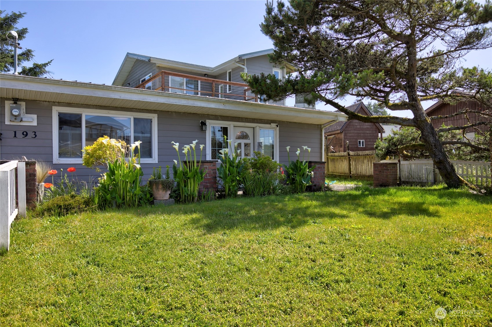 front view of a house with a yard