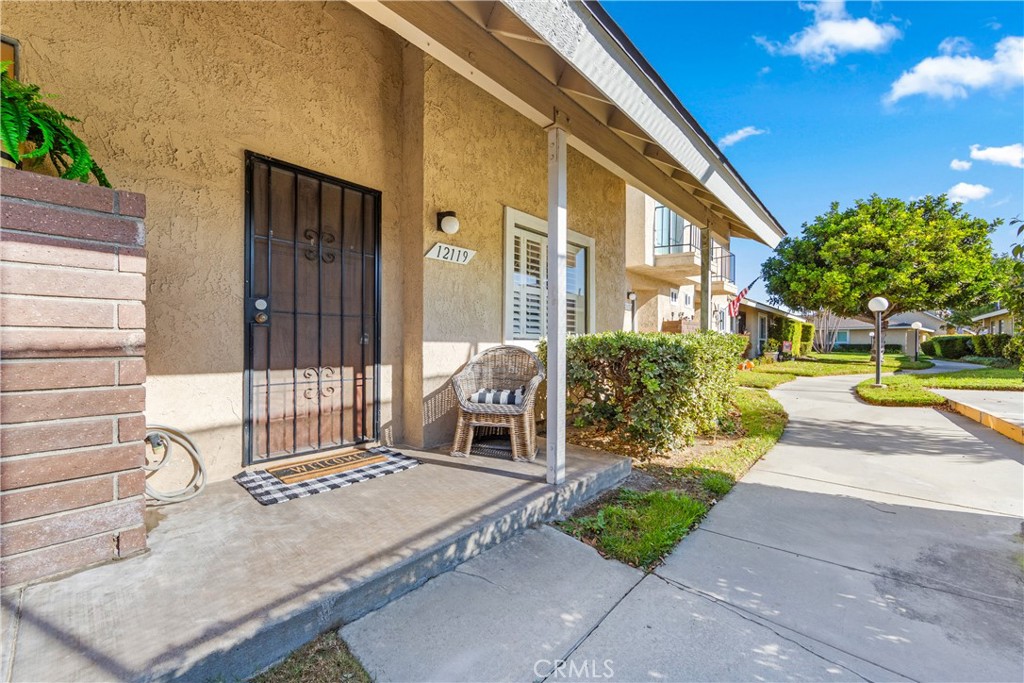 The cozy front porch faces the Tennis courts.