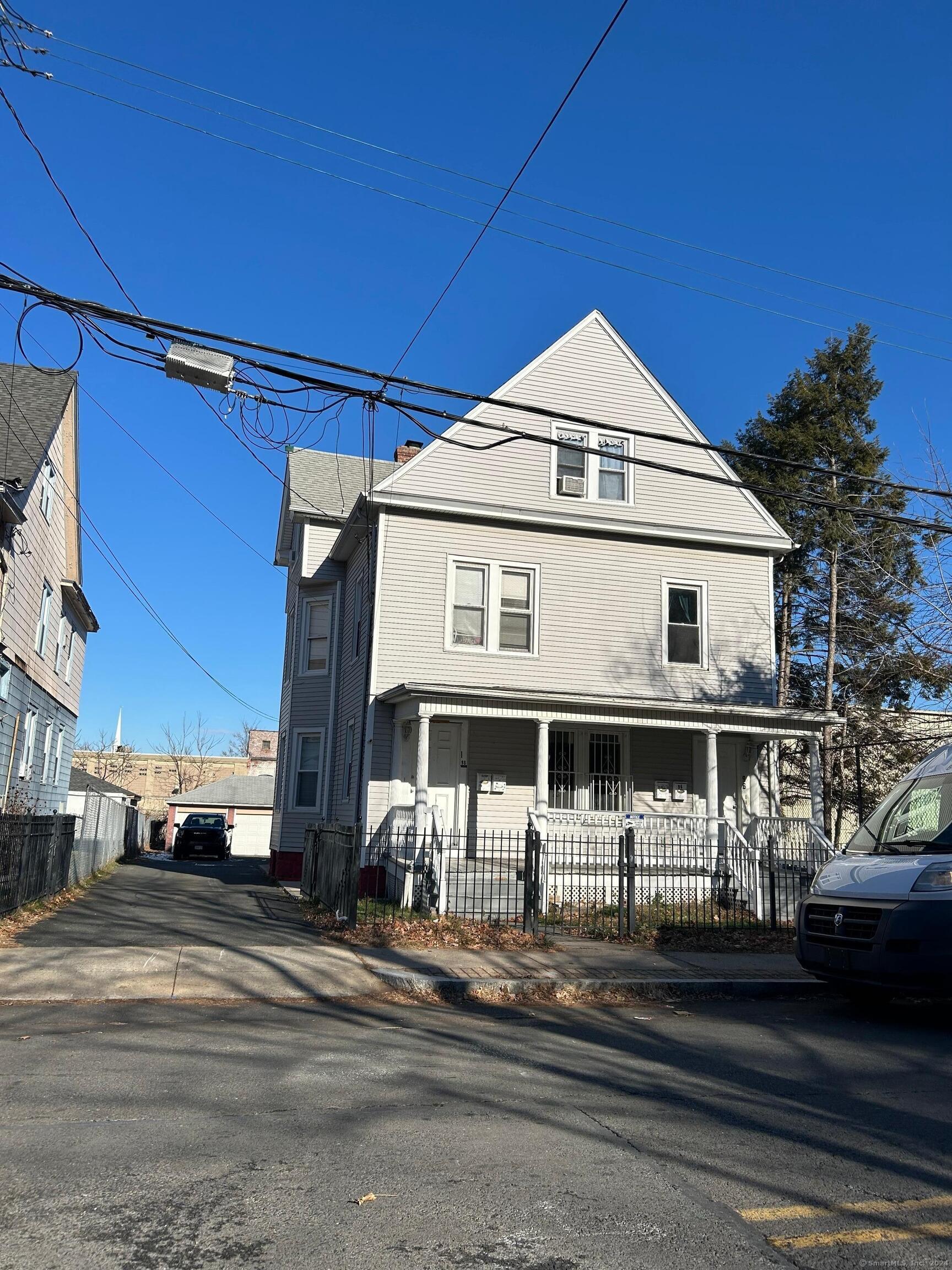 a view of a white building among the street