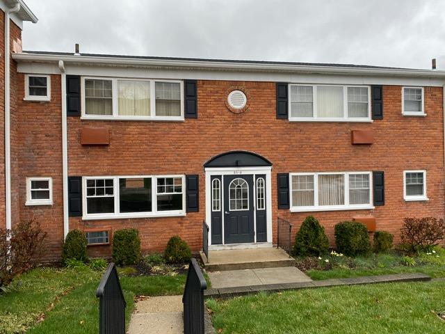 View of front of home featuring a front lawn