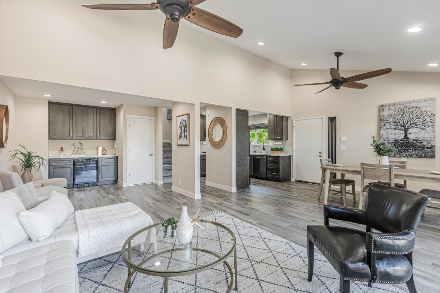 a living room with furniture and kitchen view