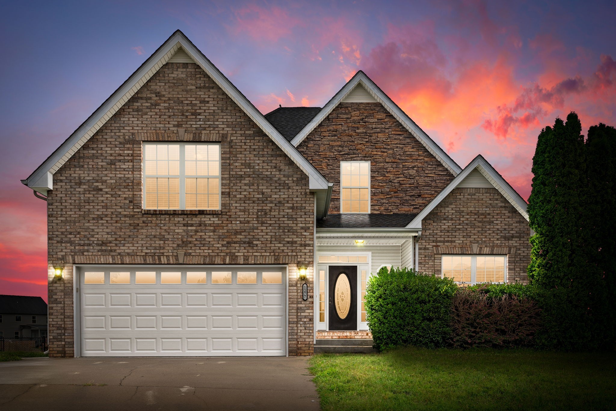 a front view of a house with a yard