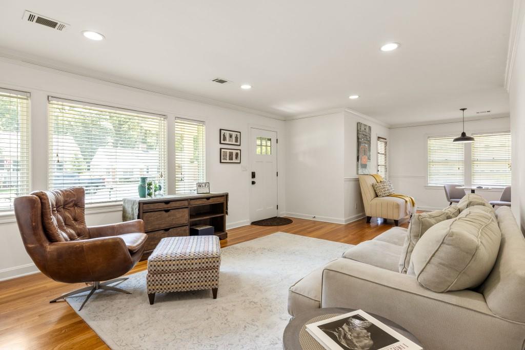 a living room with furniture or couch and a large window