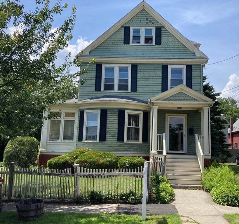 front view of a house with a yard