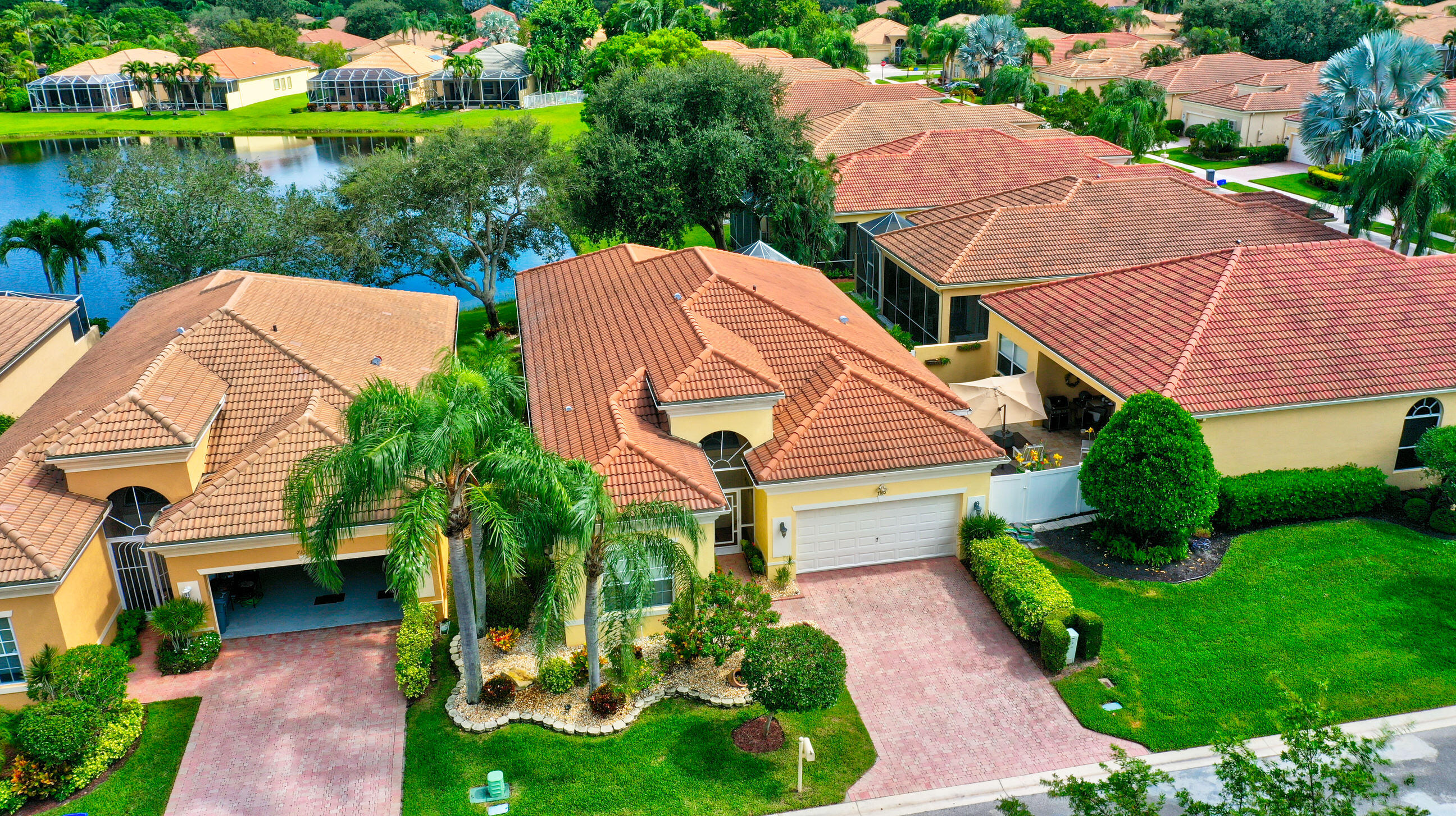 an aerial view of a house with garden space and street view